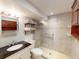 Updated bathroom with walk-in shower and tiled walls at 193 N Waterway Nw Dr, Port Charlotte, FL 33952