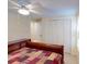 Simple bedroom with wooden furniture and a ceiling fan at 193 N Waterway Nw Dr, Port Charlotte, FL 33952