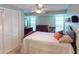Cozy bedroom featuring a ceiling fan and antique wooden furniture at 193 N Waterway Nw Dr, Port Charlotte, FL 33952