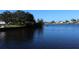 Scenic waterfront view of a peaceful canal with lush vegetation at 193 N Waterway Nw Dr, Port Charlotte, FL 33952