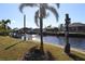 Relaxing hammock view of canal and neighboring homes at 193 N Waterway Nw Dr, Port Charlotte, FL 33952