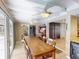 Long dining table in a sunlit room, open to kitchen and bar area at 193 N Waterway Nw Dr, Port Charlotte, FL 33952