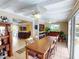 Open concept dining room with long table and kitchen views at 193 N Waterway Nw Dr, Port Charlotte, FL 33952