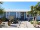Charming light blue house with a landscaped front yard at 193 N Waterway Nw Dr, Port Charlotte, FL 33952