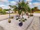 Landscaped front yard with palm trees and stone path at 193 N Waterway Nw Dr, Port Charlotte, FL 33952