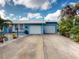 Two-car garage with a spacious driveway at 193 N Waterway Nw Dr, Port Charlotte, FL 33952