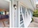 Front entrance with light blue walls and white shutters at 193 N Waterway Nw Dr, Port Charlotte, FL 33952
