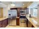 Stainless steel appliances and granite countertops highlight this updated kitchen at 193 N Waterway Nw Dr, Port Charlotte, FL 33952