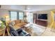 Spacious living room with sectional sofa and flat-screen TV at 193 N Waterway Nw Dr, Port Charlotte, FL 33952