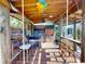 Covered patio with bar, swings, and fun beach decor at 193 N Waterway Nw Dr, Port Charlotte, FL 33952