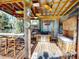 Rustic outdoor bar with built-in seating and tropical decor at 193 N Waterway Nw Dr, Port Charlotte, FL 33952
