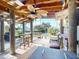 Covered patio with bar, seating, and tranquil waterfront view at 193 N Waterway Nw Dr, Port Charlotte, FL 33952
