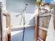 Private outdoor shower with wood enclosure and privacy screen at 193 N Waterway Nw Dr, Port Charlotte, FL 33952