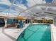 Inviting screened pool area with lounge chairs and patio furniture at 193 N Waterway Nw Dr, Port Charlotte, FL 33952