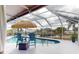 Inviting pool with canal view and tiki umbrella at 193 N Waterway Nw Dr, Port Charlotte, FL 33952