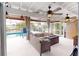 Relaxing wicker furniture on covered patio overlooking the pool at 193 N Waterway Nw Dr, Port Charlotte, FL 33952