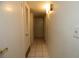 Clean hallway with tiled floor and light walls at 2155 Easy St, Port Charlotte, FL 33952