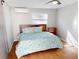 Bright bedroom with a ceiling fan, wood-look tile flooring, and an air conditioner at 22143 Lasalle Rd, Port Charlotte, FL 33952