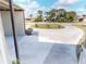 Spacious circular driveway surrounded by lush landscaping and palm trees, offering ample parking at 22143 Lasalle Rd, Port Charlotte, FL 33952