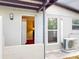 This home boasts a convenient backdoor entrance adjacent to an efficient AC unit for optimal comfort at 22143 Lasalle Rd, Port Charlotte, FL 33952