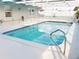 Enclosed pool with white tile and white posts at 22143 Lasalle Rd, Port Charlotte, FL 33952