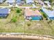 Aerial view of home with screened-in pool and garden at 2259 Kenya Ln, Punta Gorda, FL 33983