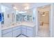 Bright bathroom with double sink vanity, tile floors, and natural light at 2259 Kenya Ln, Punta Gorda, FL 33983