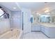 Bathroom features garden tub, tiled walls, and a double sink vanity at 2259 Kenya Ln, Punta Gorda, FL 33983
