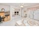 Bright bedroom with tile floors, ceiling fan, closet with mirrors, and access to the outdoors at 2259 Kenya Ln, Punta Gorda, FL 33983