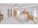 Spacious bedroom with tile floors, soft lighting, and ensuite bathroom entrance at 2259 Kenya Ln, Punta Gorda, FL 33983