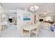 Open floor plan with dining area looking into the living spaces, offering ample natural light at 2259 Kenya Ln, Punta Gorda, FL 33983