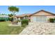 Charming home featuring a decorative brick driveway and well-manicured landscaping at 2259 Kenya Ln, Punta Gorda, FL 33983