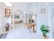 Bright and airy foyer with ceramic tile, pillars, arched openings, and mirrored wall at 2259 Kenya Ln, Punta Gorda, FL 33983