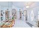 Elegant entryway with tile flooring, decorative columns, and a view into the living spaces at 2259 Kenya Ln, Punta Gorda, FL 33983