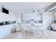 Bright kitchen with white cabinets, modern appliances, and a breakfast table for casual dining at 2259 Kenya Ln, Punta Gorda, FL 33983