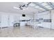Functional kitchen with white cabinets, modern appliances, and a breakfast table for casual dining at 2259 Kenya Ln, Punta Gorda, FL 33983