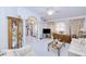 Spacious living room with columns, arched doorway, display cabinet, and a view into the entry foyer at 2259 Kenya Ln, Punta Gorda, FL 33983