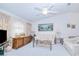 Cozy living room featuring neutral decor, a ceiling fan, and large windows with lots of natural light at 2259 Kenya Ln, Punta Gorda, FL 33983