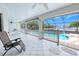 Enclosed patio with pool views, creating a perfect outdoor living space for relaxation and entertainment at 2259 Kenya Ln, Punta Gorda, FL 33983