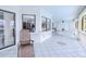 Enclosed patio with tiled flooring, comfortable seating, and beautiful outdoor views for relaxing at 2259 Kenya Ln, Punta Gorda, FL 33983