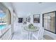 Covered patio featuring a dining area with views of the pool and surrounding landscape at 2259 Kenya Ln, Punta Gorda, FL 33983