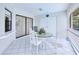 Charming patio with a cozy dining area and an indoor/outdoor feel with plenty of light at 2259 Kenya Ln, Punta Gorda, FL 33983