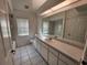 Bathroom with tub, toilet and vanity at 23104 Rountree Ave, Port Charlotte, FL 33980