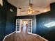 Bedroom with double doors opening to another room at 23104 Rountree Ave, Port Charlotte, FL 33980