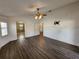 Main bedroom with wood flooring and access to bathroom at 23104 Rountree Ave, Port Charlotte, FL 33980