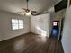 Bright bedroom with laminate flooring, ceiling fan, and double closets at 23104 Rountree Ave, Port Charlotte, FL 33980