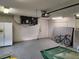 Garage with AC unit, storage space and bicycle at 23104 Rountree Ave, Port Charlotte, FL 33980