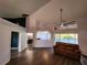 Spacious living room with hardwood floors and access to a patio at 23104 Rountree Ave, Port Charlotte, FL 33980