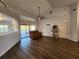 Living area with hardwood floors and sliding glass doors at 23104 Rountree Ave, Port Charlotte, FL 33980