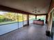 Relaxing screened porch with hot tub and tile flooring at 23104 Rountree Ave, Port Charlotte, FL 33980